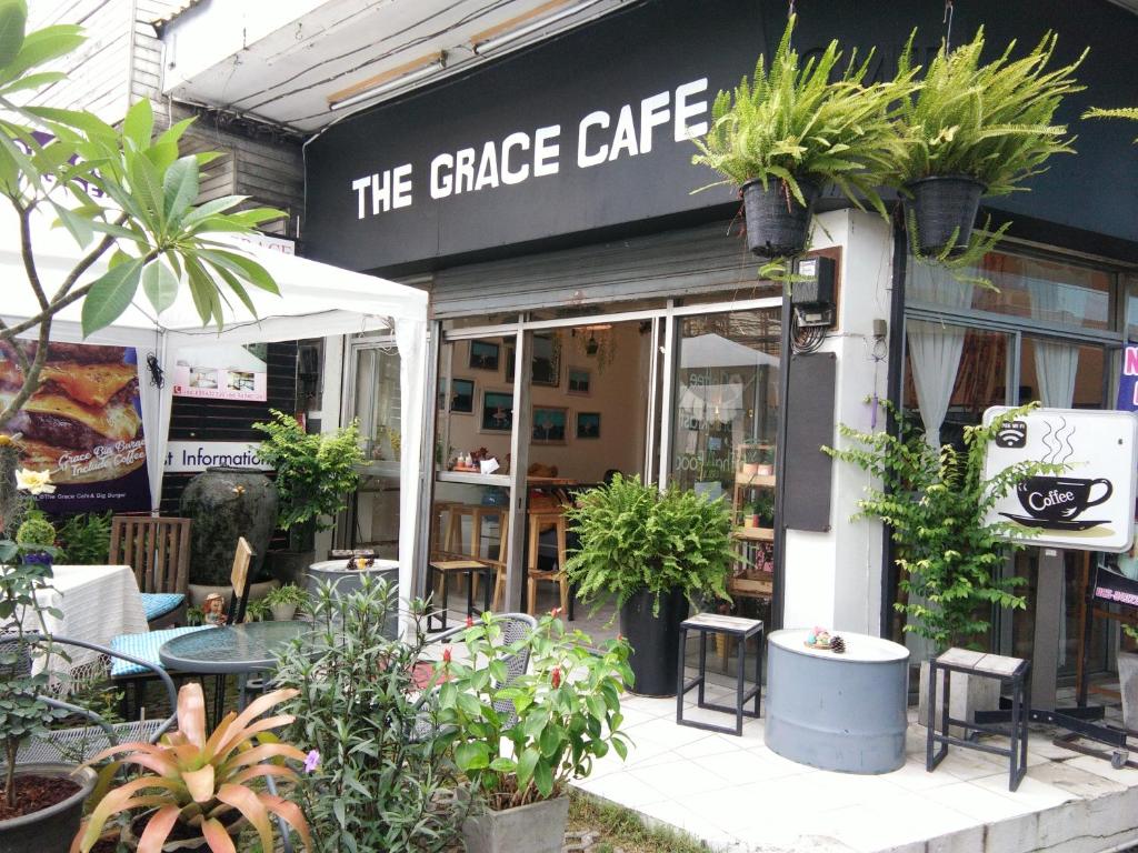 a store with potted plants on the front of it at The Grace House Chiangmai in Chiang Mai