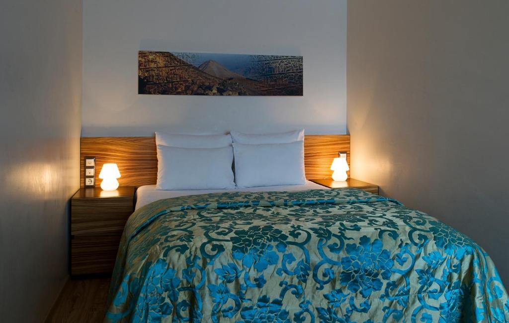 Postel nebo postele na pokoji v ubytování Ararat All Suites Hotel Klaipeda