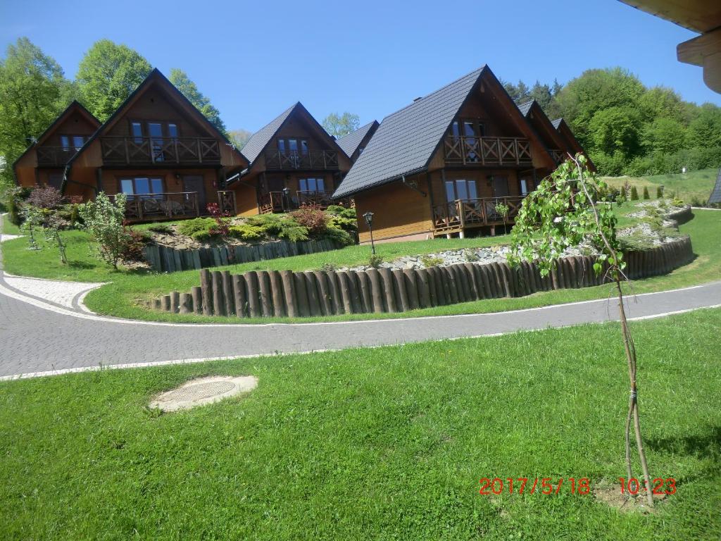 a house on the side of a road at Domki u Piotra in Solina