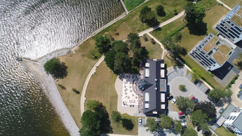 an aerial view of an island next to the water at Hotel Strandleben in Schleswig