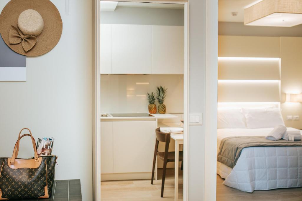 Postel nebo postele na pokoji v ubytování Aparthotel Touring