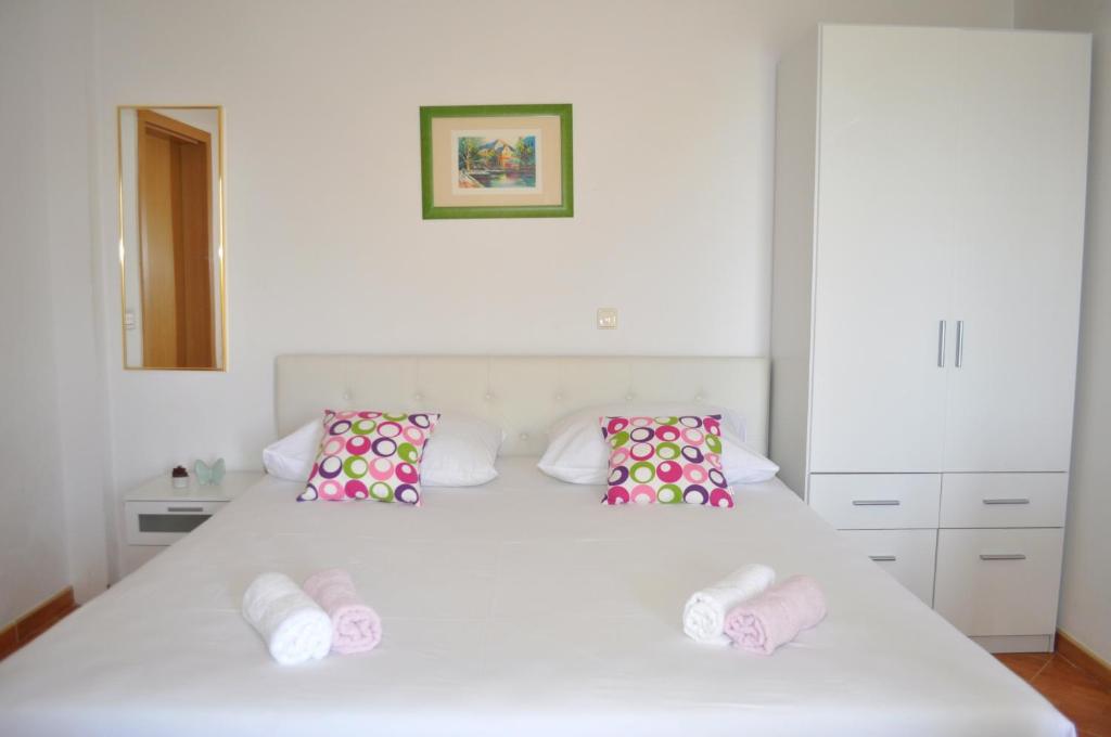 Postel nebo postele na pokoji v ubytování Apartments Ivica