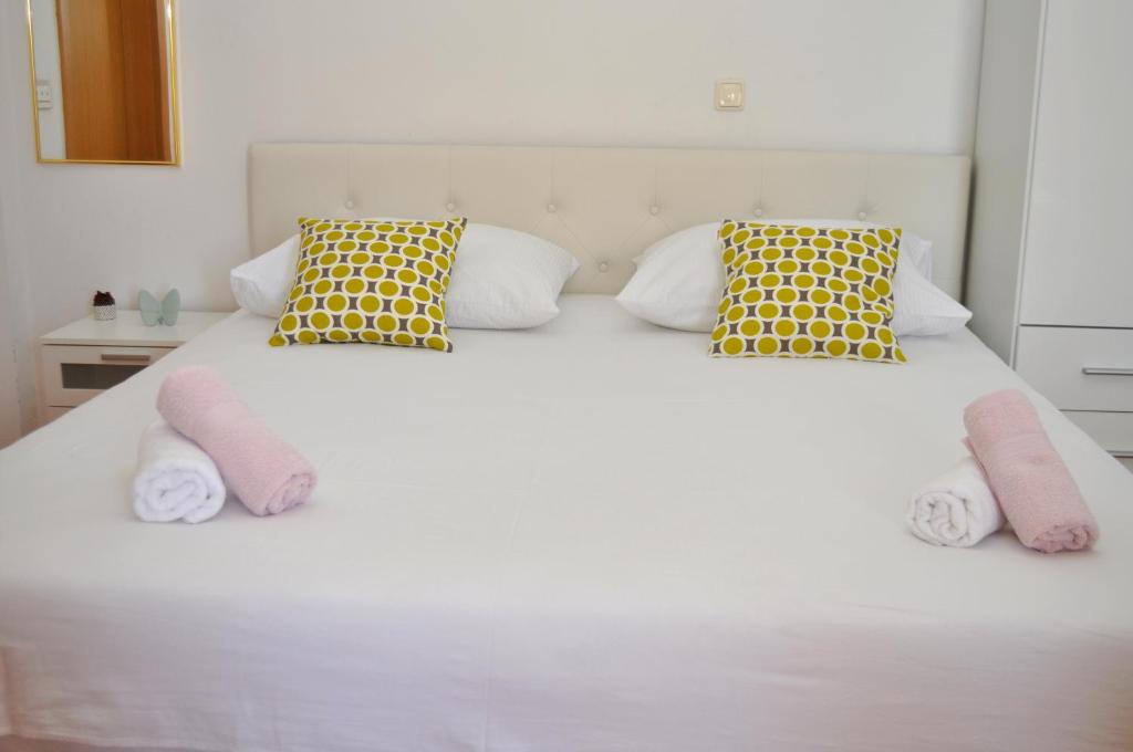 Postel nebo postele na pokoji v ubytování Apartments Ivica