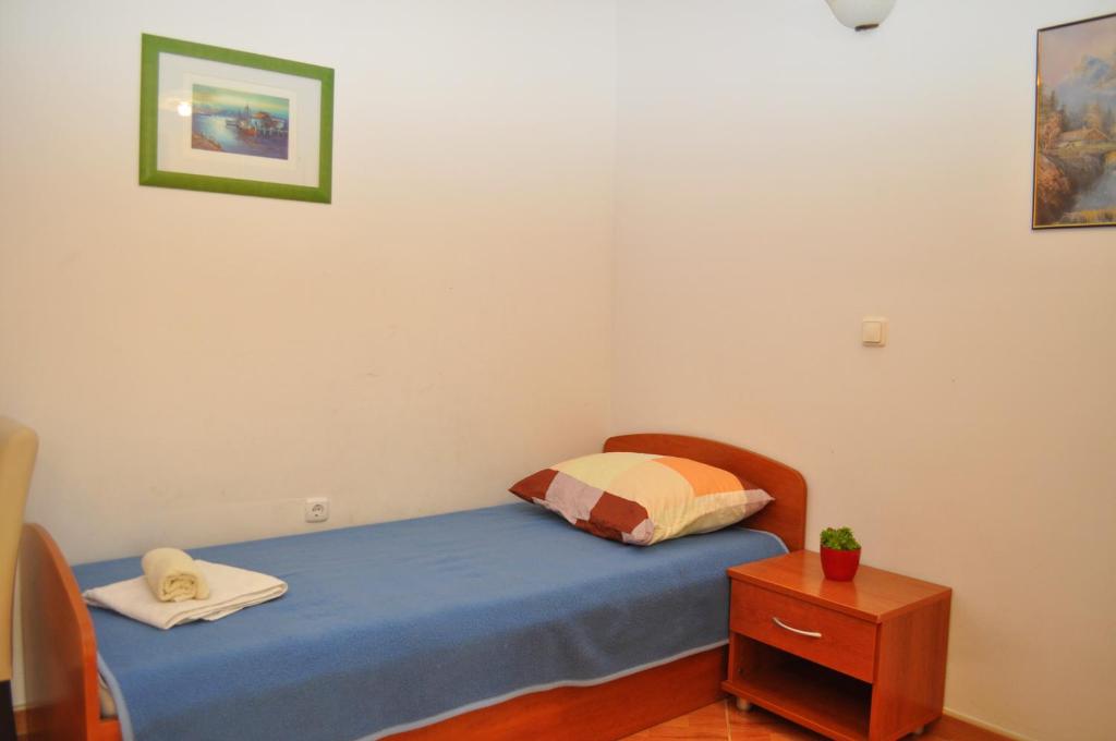 Postel nebo postele na pokoji v ubytování Apartments Ivica