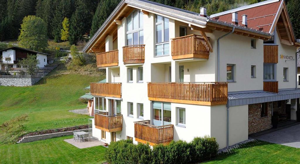 a building with balconies on the side of it at Haus Sonneneck - ski in & out in Sankt Anton am Arlberg