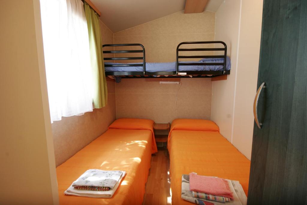 Postel nebo postele na pokoji v ubytování Camping Reno