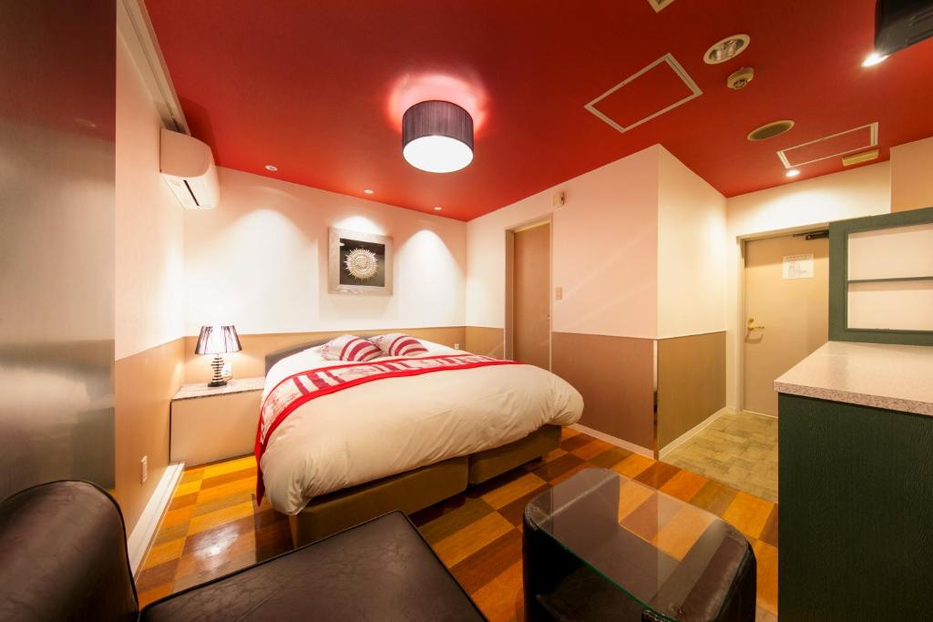 Postel nebo postele na pokoji v ubytování Hotel Eldia Modern Kobe(Adult Only)