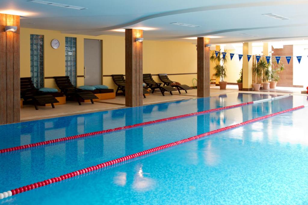 a large swimming pool in a hotel room at Aparthouse Borovo in Sofia