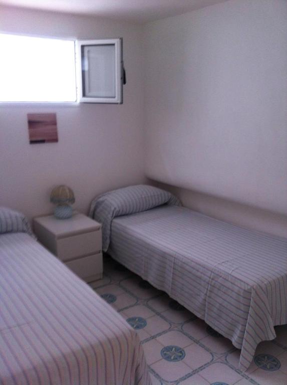 Кровать или кровати в номере Rosa Marina Frontline Beach