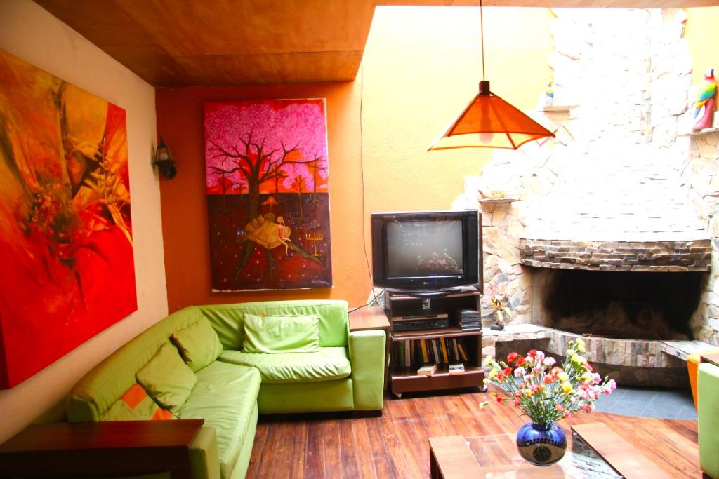 TV a/nebo společenská místnost v ubytování Casa del Arupo