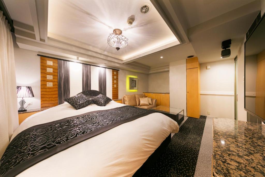 Postel nebo postele na pokoji v ubytování Hotel Eldia Modern Kobe(Adult Only)
