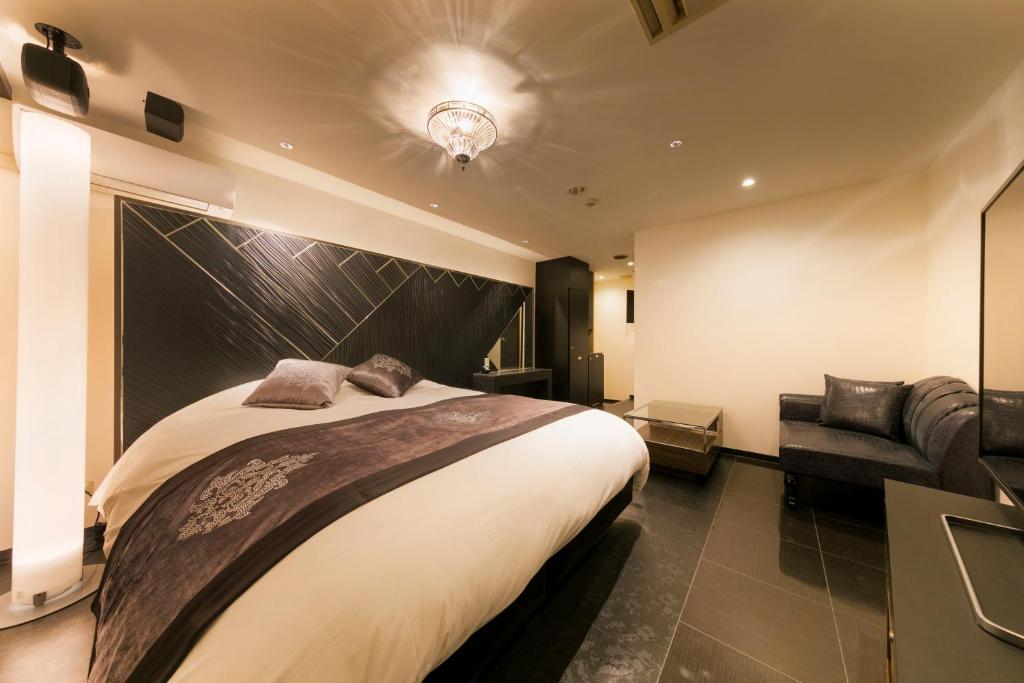 Postel nebo postele na pokoji v ubytování Hotel Eldia Modern Kobe(Adult Only)