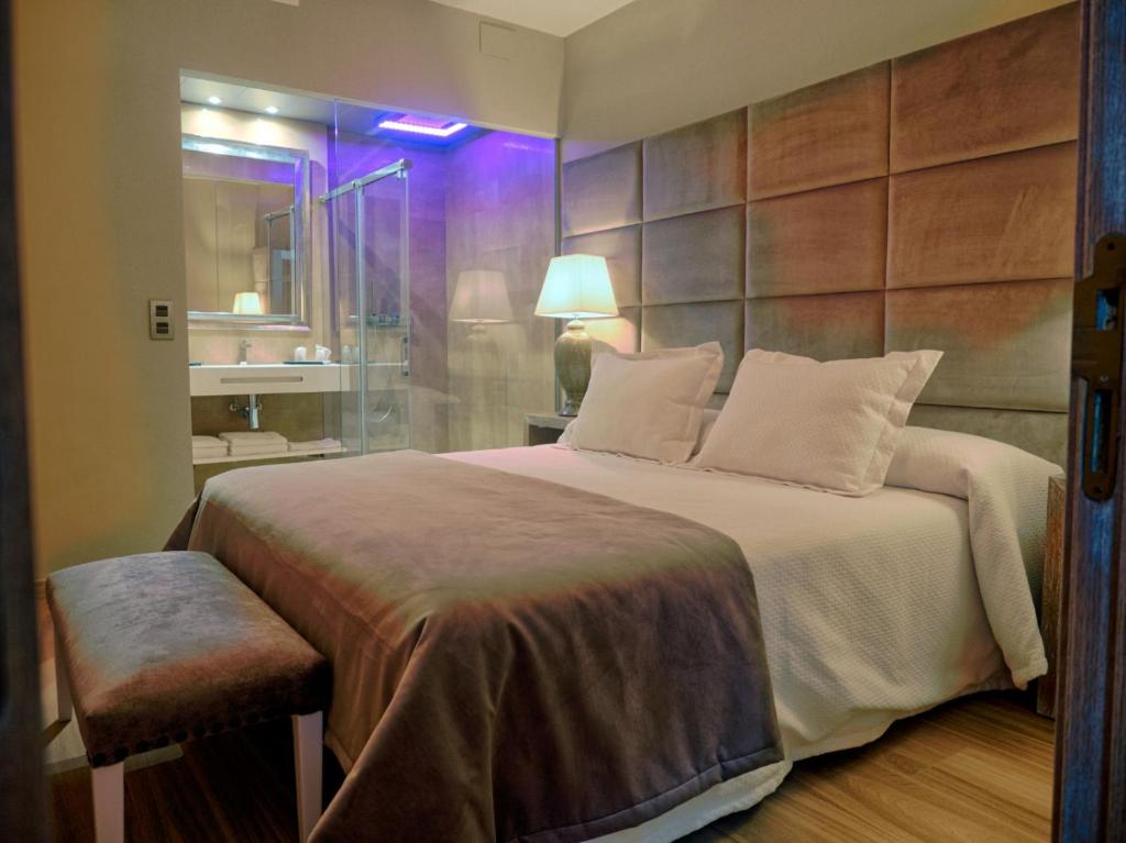Postel nebo postele na pokoji v ubytování Hostal San Andres