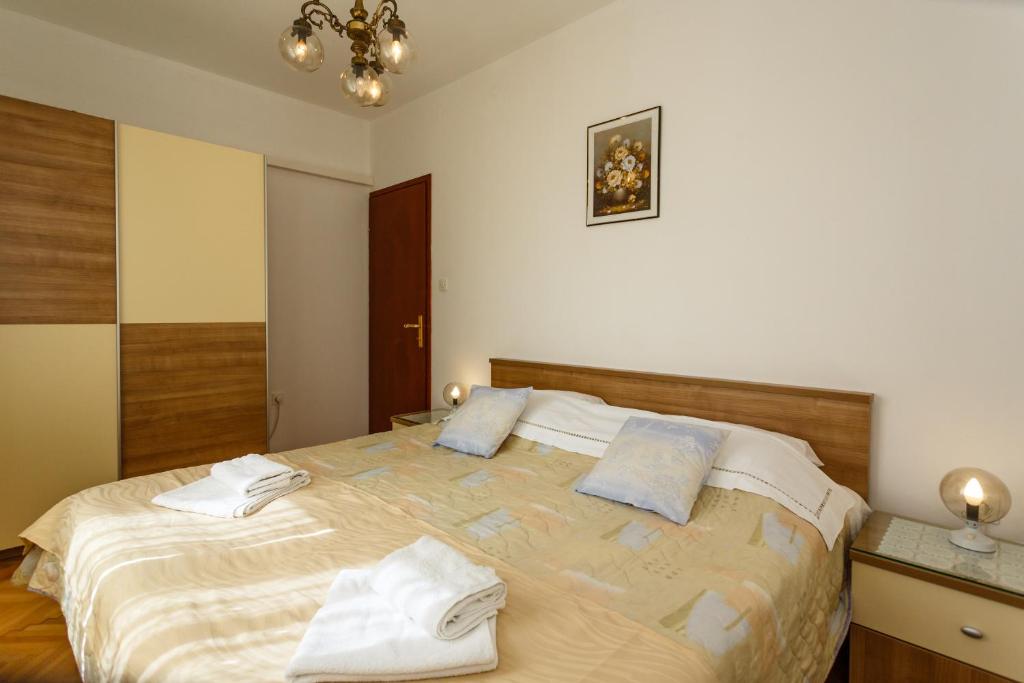 Łóżko lub łóżka w pokoju w obiekcie Villa Rosi