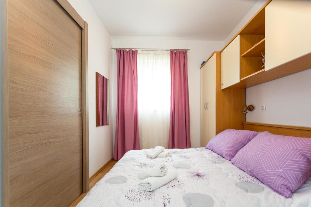 Łóżko lub łóżka w pokoju w obiekcie Villa Rosi