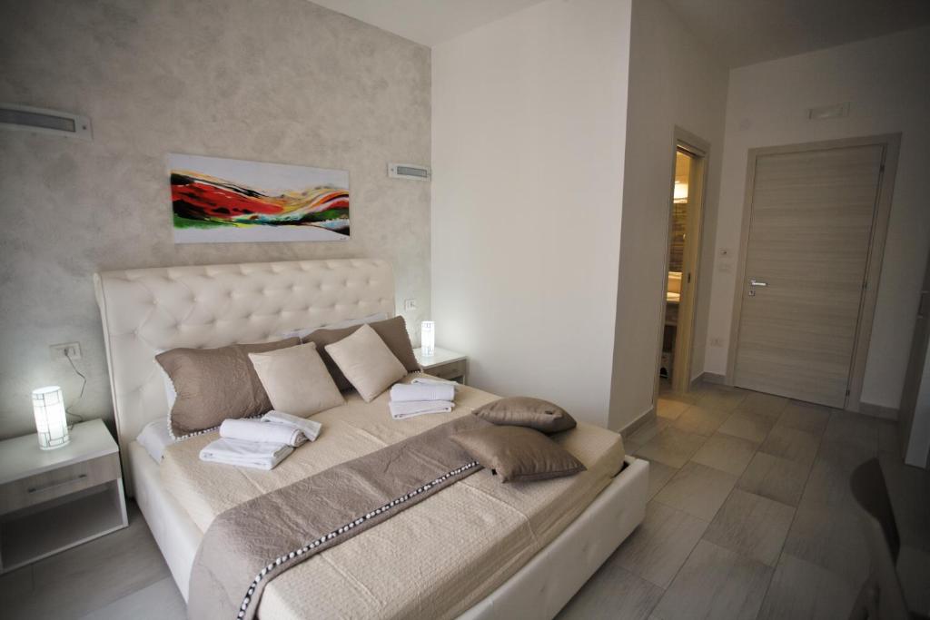Łóżko lub łóżka w pokoju w obiekcie Central Apartments