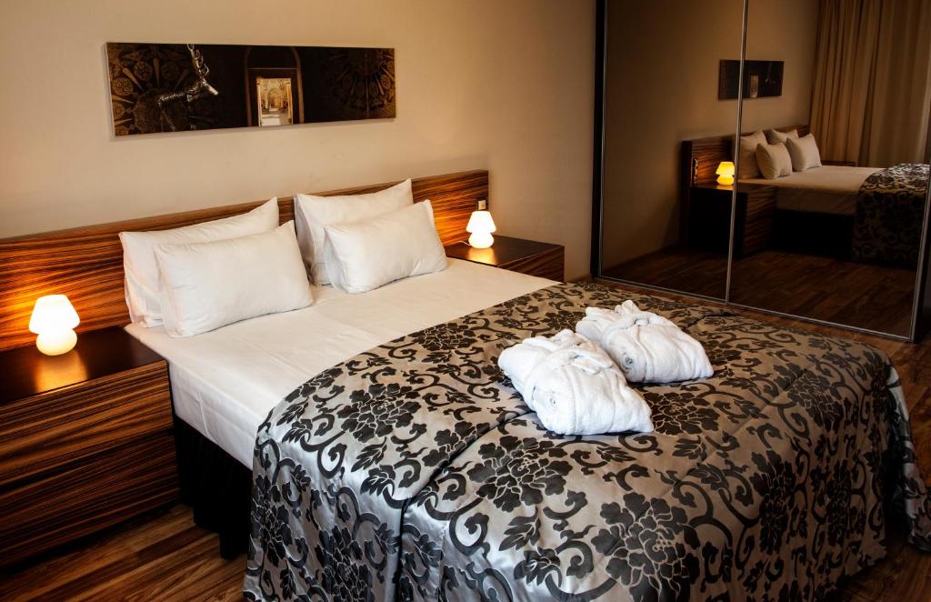 Postel nebo postele na pokoji v ubytování Ararat All Suites Hotel Klaipeda