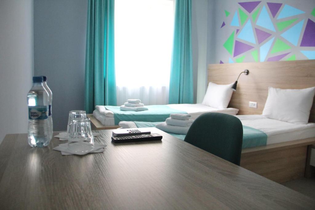 Ліжко або ліжка в номері Blum Hotel