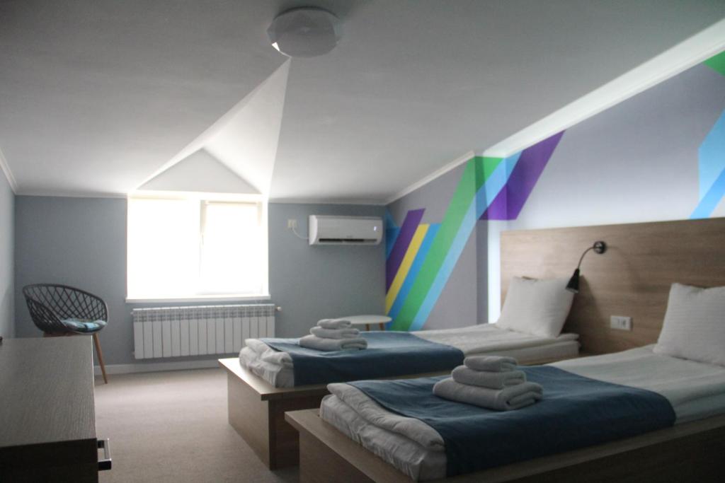 Ліжко або ліжка в номері Blum Hotel