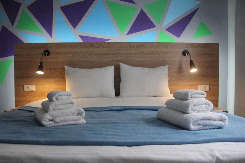 Ліжко або ліжка в номері Blum Hotel
