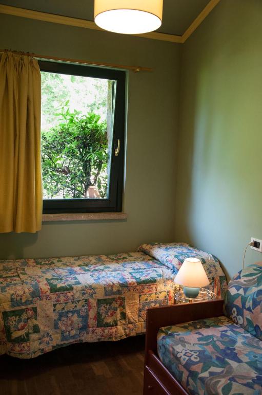 Postel nebo postele na pokoji v ubytování Residence Tourist