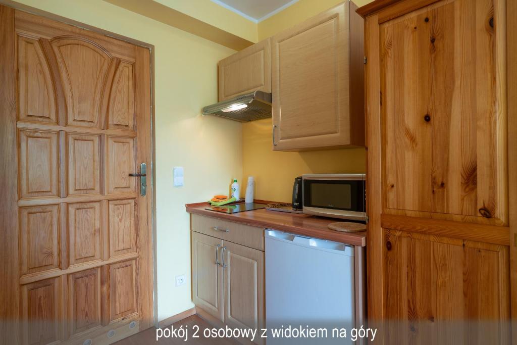 Kuchyň nebo kuchyňský kout v ubytování Willa Gwiazda