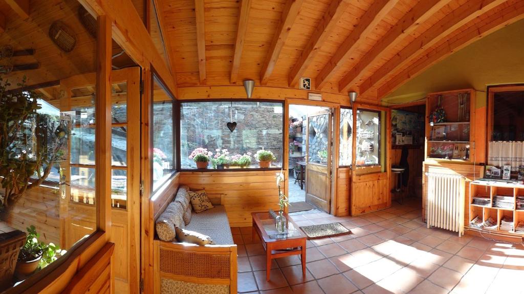 an inside view of a house with a wooden ceiling at Xalet Refugi Pere Carné in La Molina