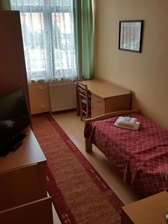 Postel nebo postele na pokoji v ubytování Grand Hotel