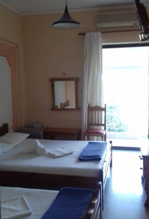 Postel nebo postele na pokoji v ubytování Hotel Ionio