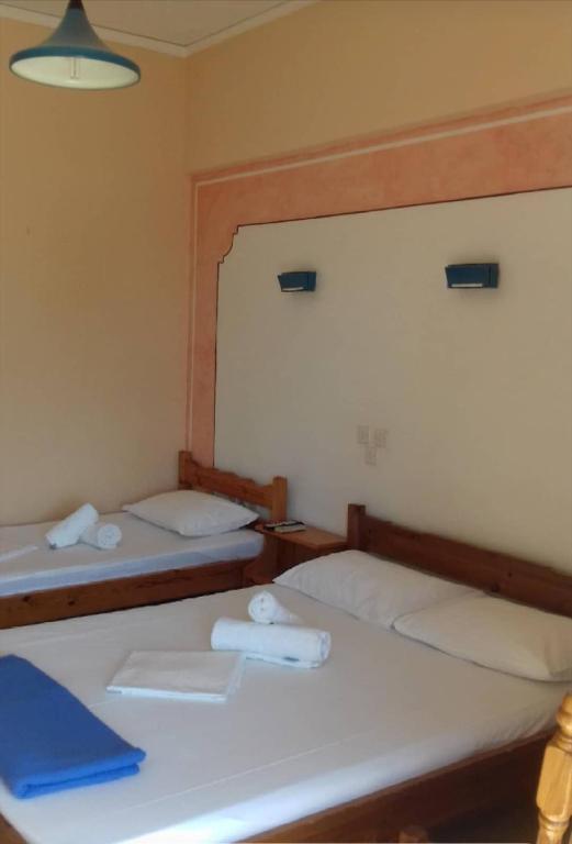Postel nebo postele na pokoji v ubytování Hotel Ionio