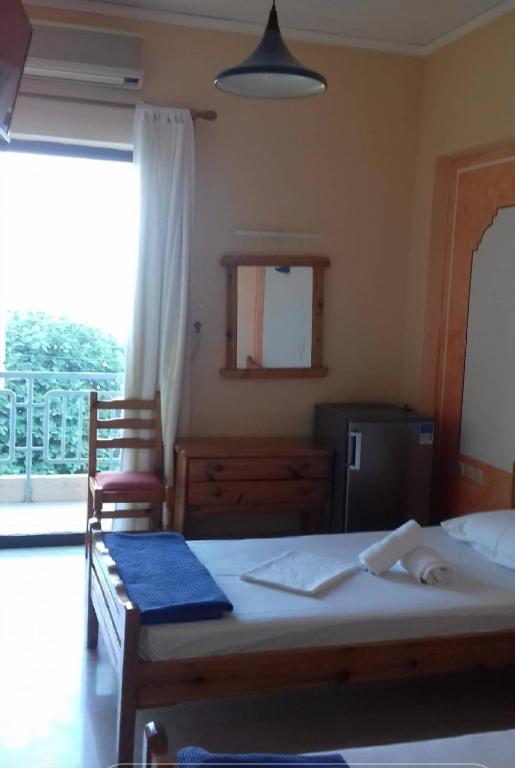 Postel nebo postele na pokoji v ubytování Hotel Ionio