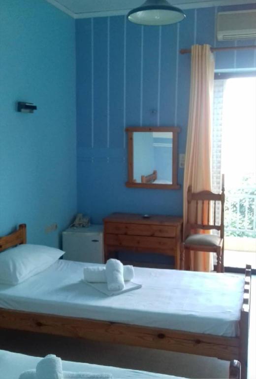 Postel nebo postele na pokoji v ubytování Hotel Ionio