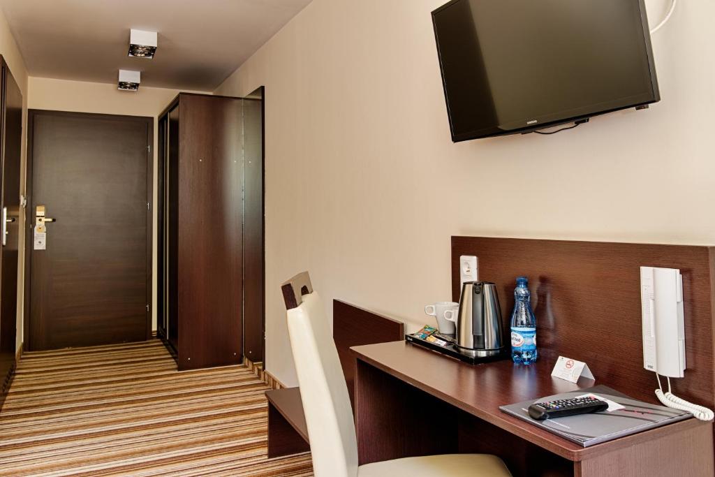 TV a/nebo společenská místnost v ubytování Boutique Hotel's Kwiska - Legnicka