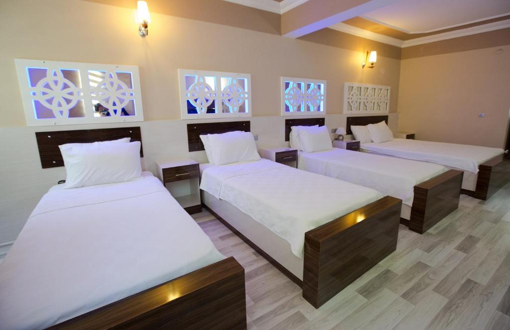 Postel nebo postele na pokoji v ubytování Ozbay Hotel
