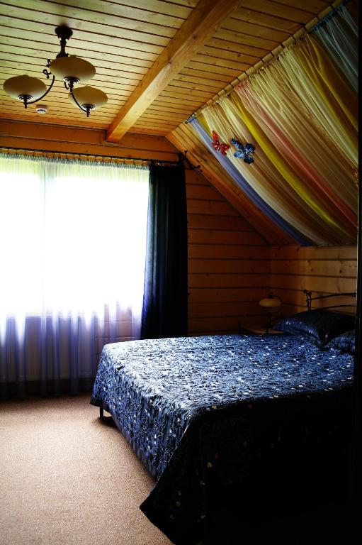 Postel nebo postele na pokoji v ubytování Villa Iris
