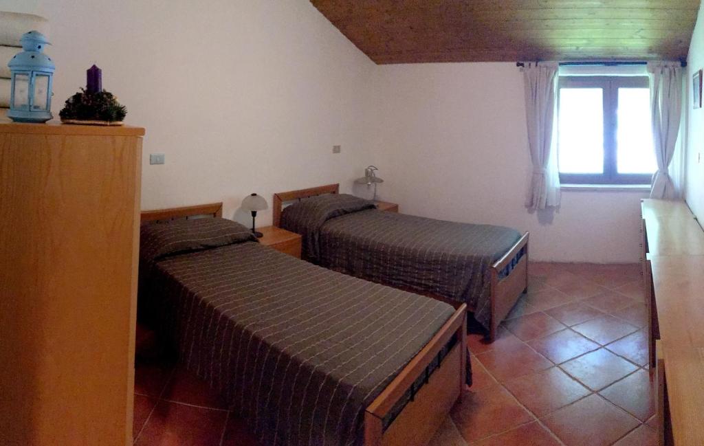Postel nebo postele na pokoji v ubytování Bosco delle Rune ..un angolo di paradiso