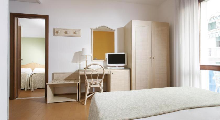 Ein Bett oder Betten in einem Zimmer der Unterkunft Hotel Croce Di Malta