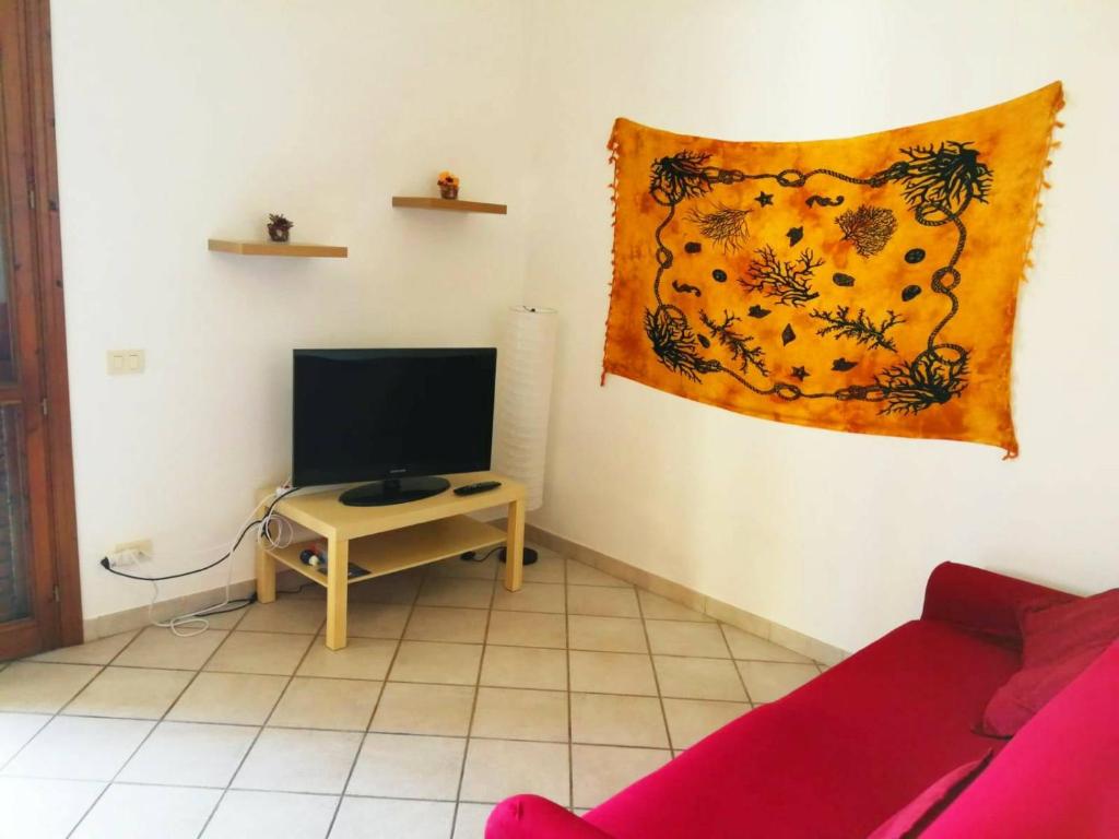 TV a/nebo společenská místnost v ubytování Appartamento La Cava