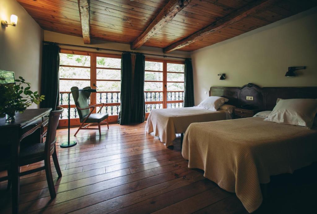 Postel nebo postele na pokoji v ubytování Hotel Caldas