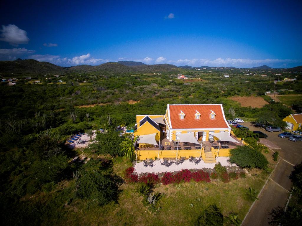 an overhead view of a house with a red roof at Landhuis Klein Santa Martha Boutique Hotel Restaurant. in Dorp Soto