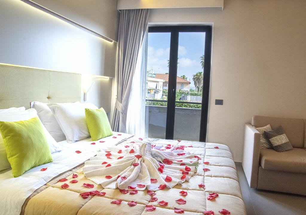 Postel nebo postele na pokoji v ubytování Hotel Miramare