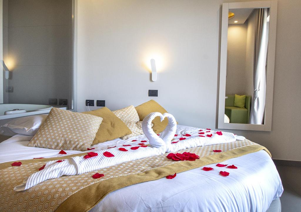 Postel nebo postele na pokoji v ubytování Hotel Miramare