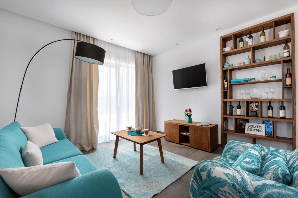 TV a/nebo společenská místnost v ubytování Hotel Eleven