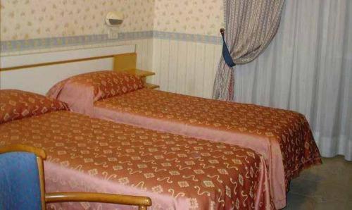 Postel nebo postele na pokoji v ubytování Hotel Demetra Capitolina