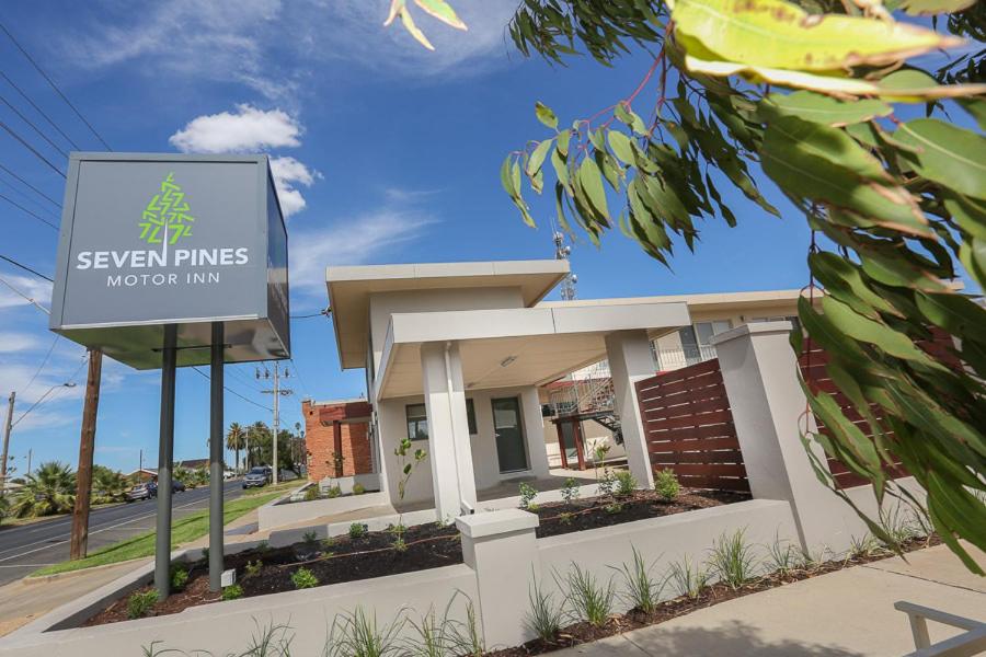 a sign in front of a building at Seven Pines Motor Inn in Mildura