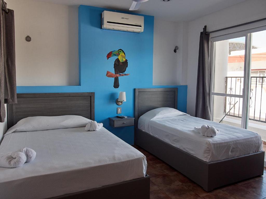 Postel nebo postele na pokoji v ubytování Hotel Tabasco Rio