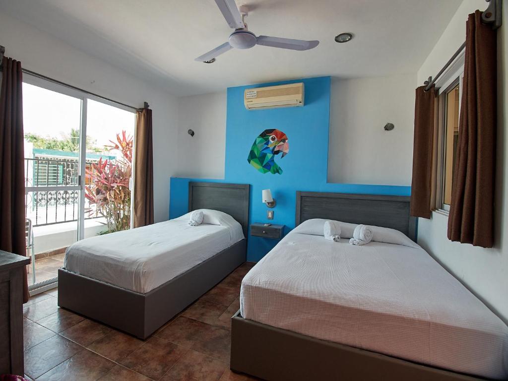 Postel nebo postele na pokoji v ubytování Hotel Tabasco Rio