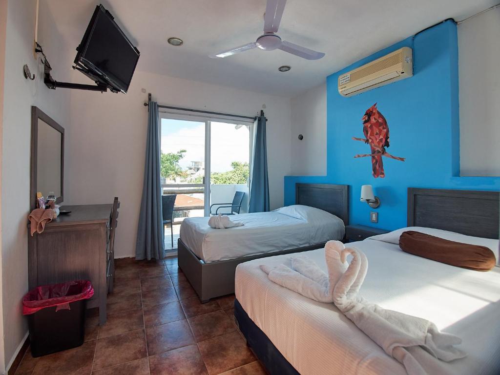 Postel nebo postele na pokoji v ubytování Hotel Tabasco Rio