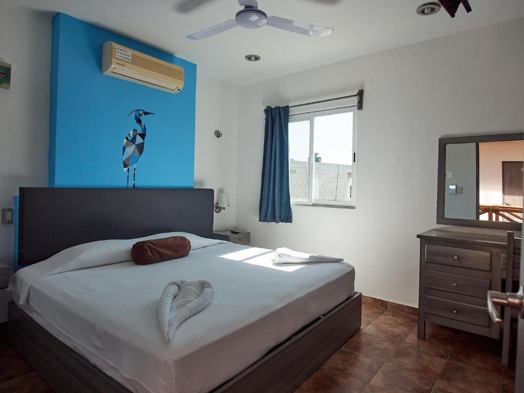 Postel nebo postele na pokoji v ubytování Hotel Tabasco Rio