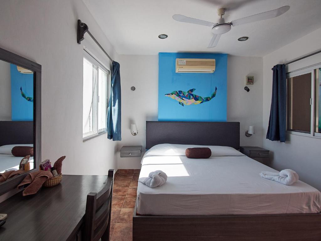 Postel nebo postele na pokoji v ubytování Hotel Tabasco Rio